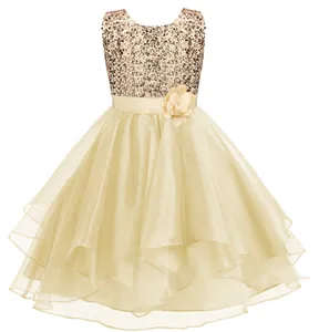 Detail of flower belt and shimmering sequins on champagne lace flower girl dress