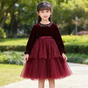 Detail of girls' deep red velvet princess dress with sequined mesh skirt and rhinestone collar