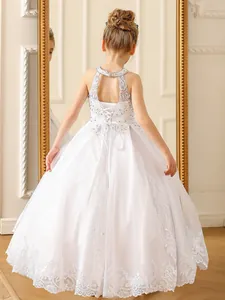 White lace flower girl dress with ball gown skirt and elegant corset back for weddings