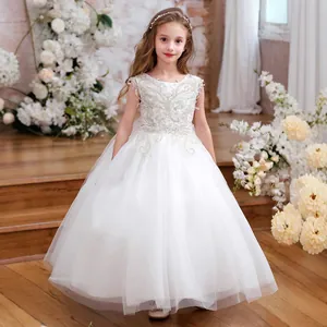 Exquisite floral lace embroidery on the sleeveless bodice of the white girl's gown