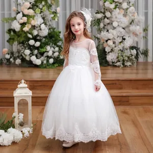 Close-up of white princess dress featuring intricate lace sleeves and floral appliques