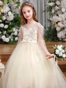 Elegant champagne tulle girls party dress with floral silver sequins and bow detail