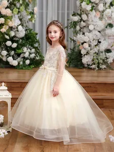 Girl champagne tulle ball gown with lace long sleeves and sequin embroidery details