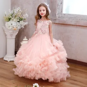 Detail of pink girls princess gown featuring luxury lace embroidery and layered tulle fabric