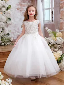 White sleeveless flower girl dress with silver lace embroidery and puffy tulle skirt