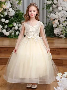 Detail of champagne girls princess dress with lace floral embroidery and tulle skirt