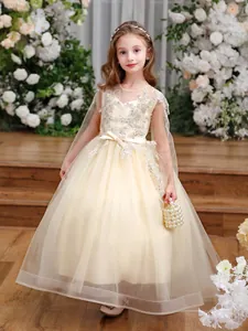 Detail of champagne flower sequins and layered tulle on children's formal princess gown