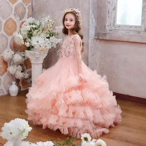 Detail of pink girls princess dress featuring multi-layered tulle ruffles and floral embroidery