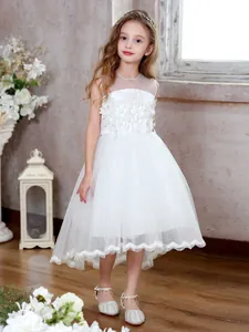 Detailed view of floral lace embroidery and sheer mesh neckline on the white girl gown