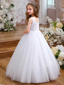 White sleeveless princess flower girl dress with sparkling tulle and pearl details