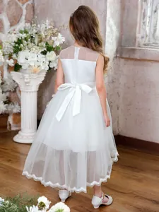 White sleeveless girls ball gown with layered tulle train and back bow decoration
