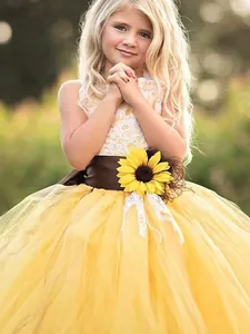 Flower girl princess dress with white lace bodice and yellow tulle skirt with sunflower