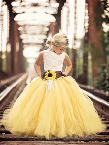 Flower girl dress with white lace bodice, sunflower waist belt and yellow tulle tutu skirt