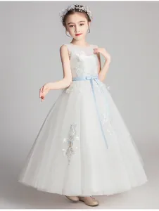 Detail of girls princess dress with blue embroidery lace and mesh layers