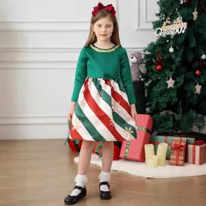 Detail of Christmas girl dress with sequins collar and golden snowflake pattern on stripes