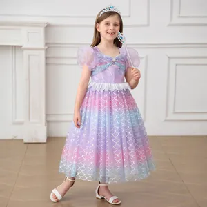Detail of mermaid princess dress featuring sequin bodice, pearl trim and glitter fish scale tulle