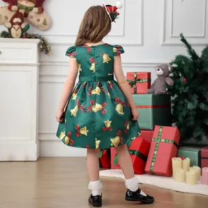 Rear view of green satin Christmas dress with gold bell prints and delicate flutter sleeves