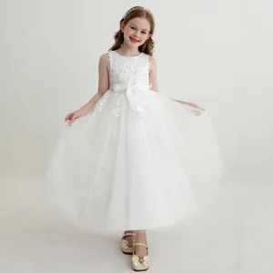 Detailed lace floral embroidery and multi-layer tulle on a white flower girl dress