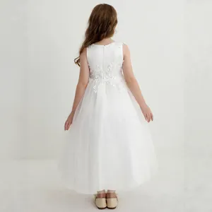Detail of white lace flower girl dress back with multi-layer tulle and hidden zipper