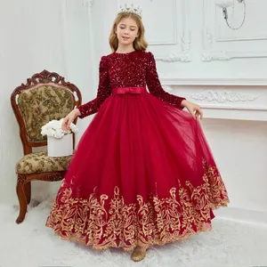 Detail of burgundy girl dress with sequins, bow ribbon and gold embroidery lace