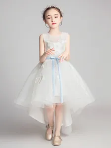 Sleeveless white tulle flower girl dress with floral embroidery and high-low hemline