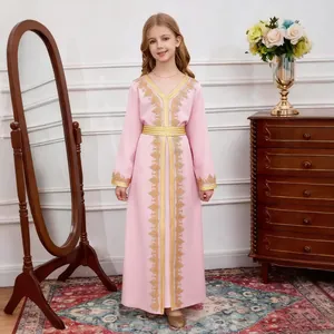 Detail of pink girls kaftan dress featuring gold floral embroidery and metallic belt