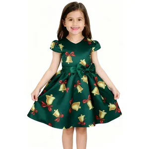 Detailed front view of green girls' Christmas dress with gold bell and red bow patterns