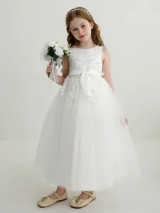 Elegant white lace flower girl dress with layered tulle skirt and bow for weddings