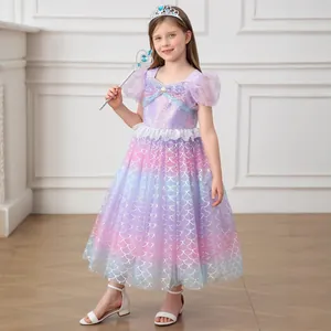 Close-up of sequined bodice with blue bow and mermaid scale gradient skirt detail