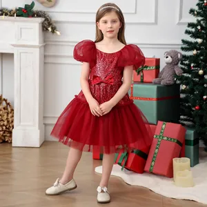 Detail of red girls' princess dress featuring sparkling sequins and mesh puff sleeves