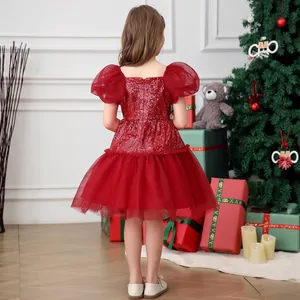 Rear view of festive red girls princess dress with sequins and mesh puff sleeves