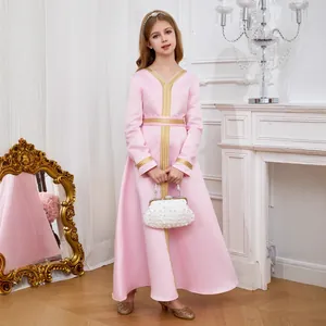 Detail of pink satin girls' kaftan dress with golden embroidery and pearl handbag