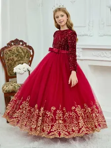 Red sequin girls princess gown with long sleeves and gold baroque embroidery details