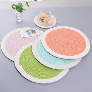 Thick woven cotton placemats in pastel colors with matching coasters for dining table decor