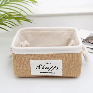 Close-up of rectangular jute storage bin with rope handles and soft fabric lining
