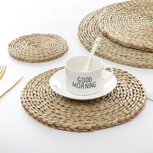 Handwoven natural seagrass placemats and coasters for heat-resistant dining table decor