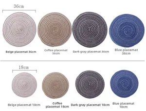 Close-up of circular woven placemats in multiple sizes and neutral colors for home dining