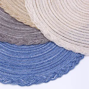 Detailed macro view of woven round placemats showing heat resistant wavy edges and texture