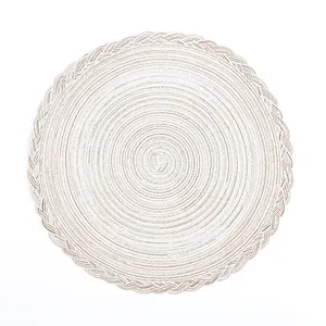 Nordic round woven placemat with beige spiral pattern and decorative braided edge borders
