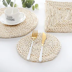 Close-up of hand-woven natural corn husk heat resistant placemat in round and square shapes