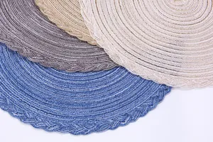 Detailed macro view of woven heat-resistant table mats with intricate braided edges and textures