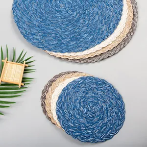 Close-up of colorful round woven placemats in ramie cotton with spiral texture