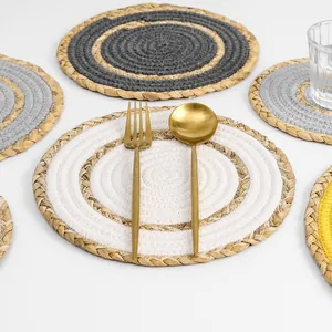 Handwoven round cotton and straw placemats with colorful concentric circles set