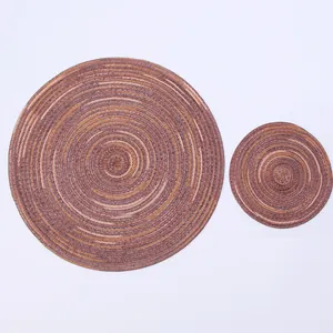 Detail of round woven ramie placemats showing spiral texture and brown gradient tones