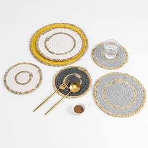 Detail of multi-size round woven place mats and coasters with natural spiral texture