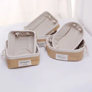 Close-up of jute storage baskets with white canvas lining and thick cotton rope handles