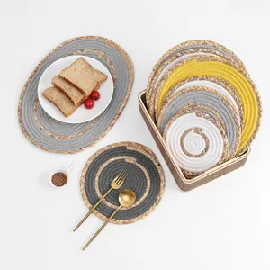 Detail of colorful woven table mats and storage basket with elegant dining accessories