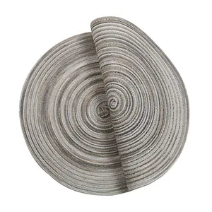Detailed macro view of flexible woven ramie table mat with spiral multi-color gradient