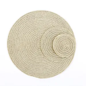 Detailed view of gold woven placemats in three sizes with spiral texture on white background