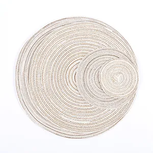 Detailed macro of woven round placemats in beige and light coffee cotton fiber